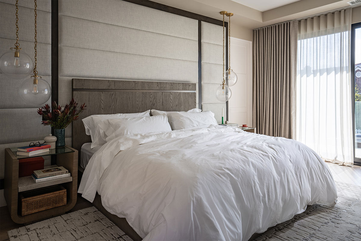 Bed with white pillows and sheets