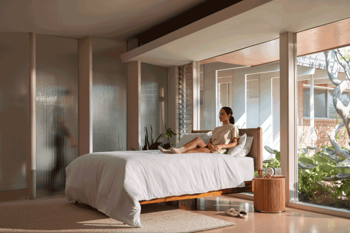 Woman laying on sheets